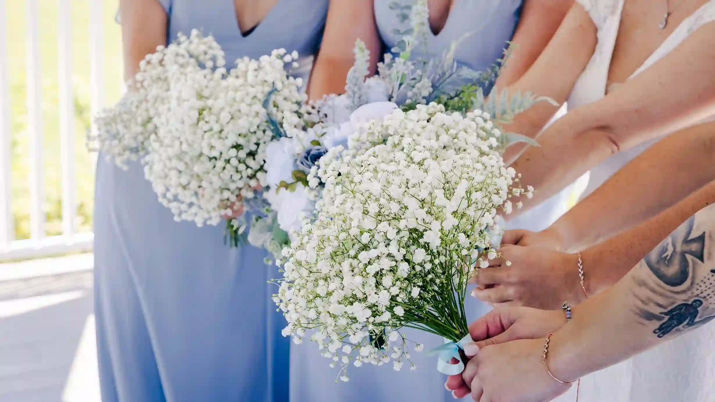 A bride and groom, filled with love, gaze into each other's eyes before a wedding kiss at the altar.