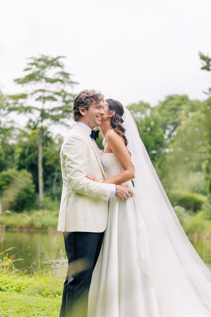 bride-whisper-groom-dress-outside-nj-wedding-day