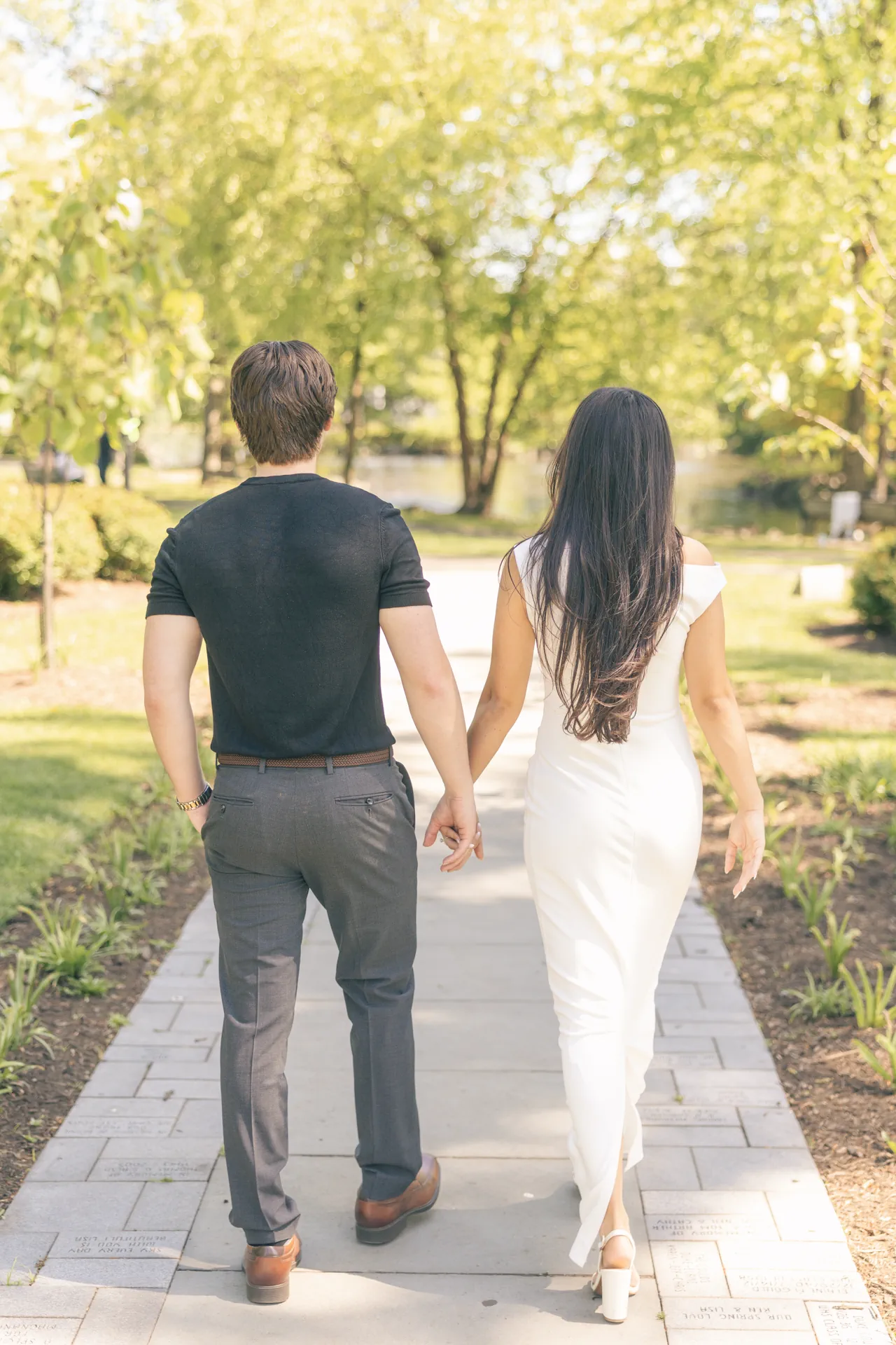 couple-walking-away-stone-path-engagement