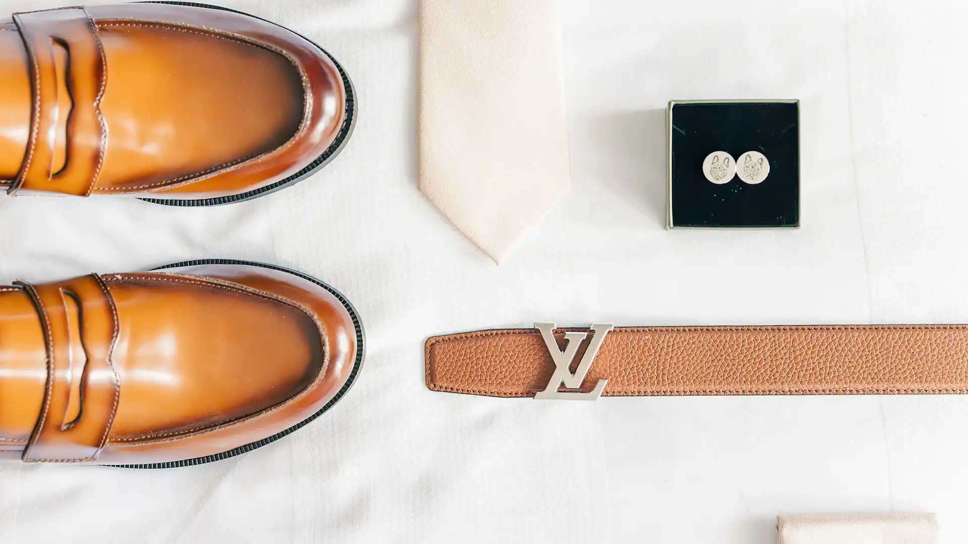 The details of the grooms wardrobe captured. Shoes, tie, belt handkerchief and custom engraved cufflinks of his dog, Summer.