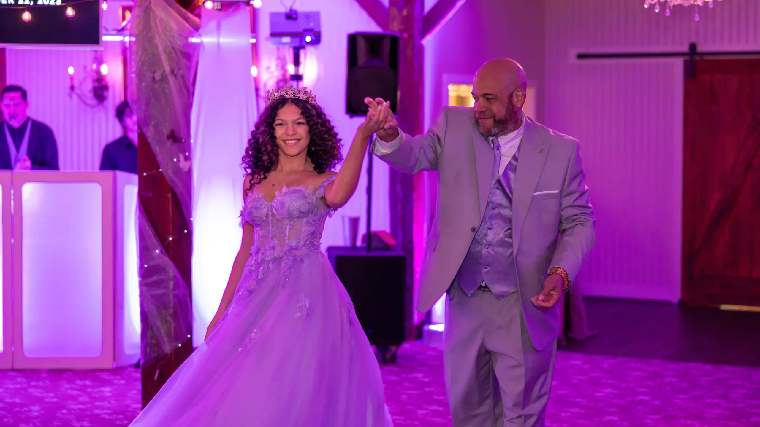 Joyous dance between a father and his daughter at her Sweet 16 celebration.